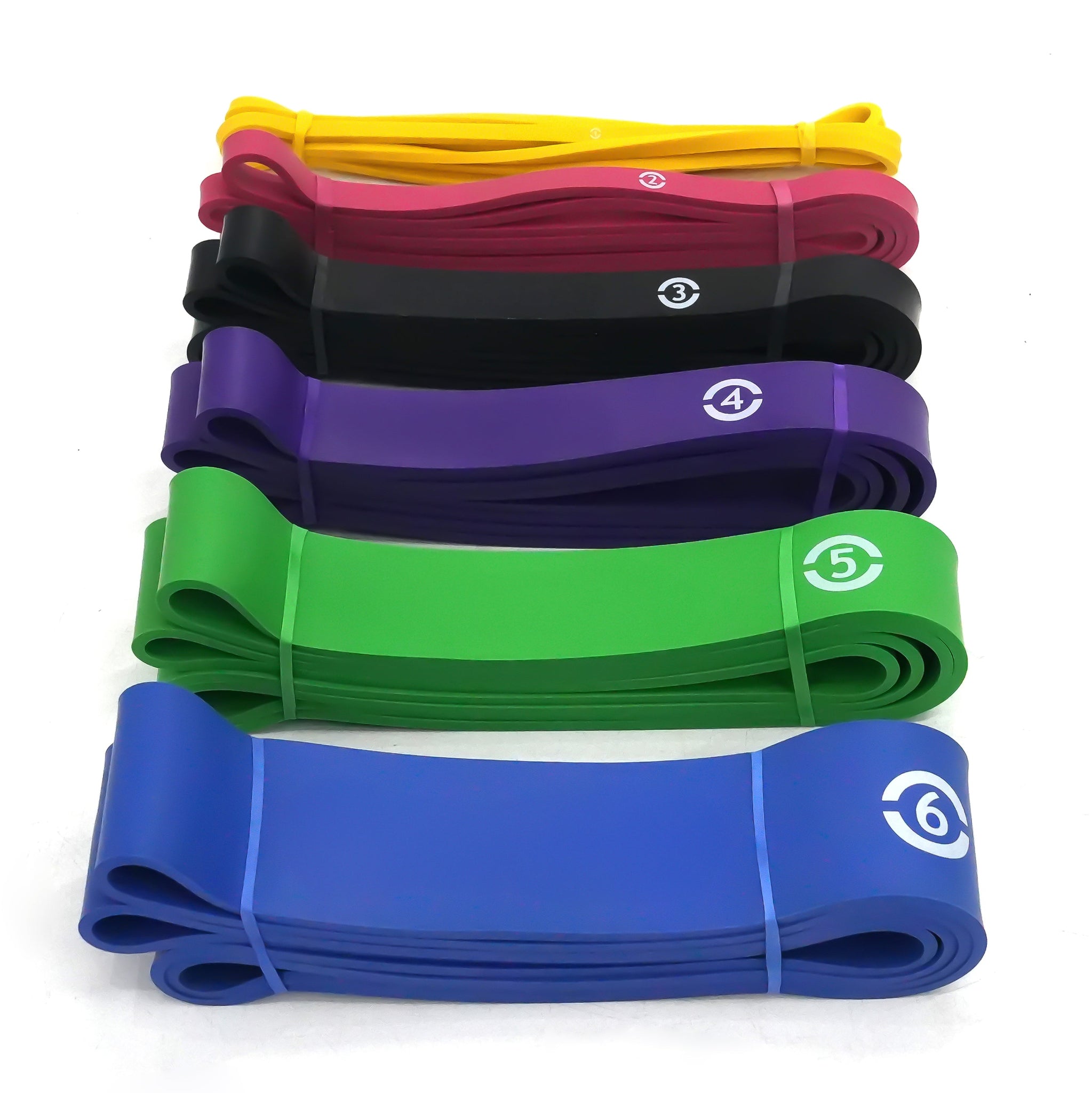 Set of resistance bands in various colors with visible strength numbering on a white background